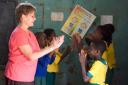 Kathy teaches the kids a clapping song game which they later repeated in a giant circle