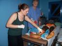 Jessica works with Dr. Hewitt clean a patients wound from a fractured leg