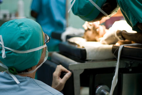 Dr. Faile examines a surgery patient before operating