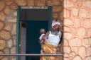 A woman with her young child waits to be called into the examination room