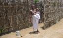 A Trokosi slave and her child at a shrine in south-eastern Ghana
