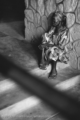 A patient waits on clinic day to see a doctor at BMC.