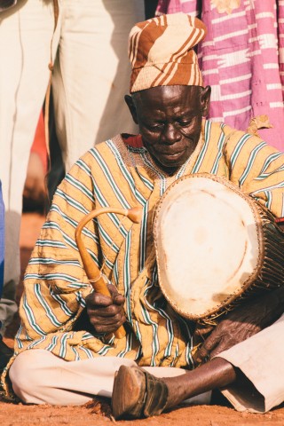 The NaYiri's Chief Drummer (lunga) sings through the past kings' names dating back to the 15th century